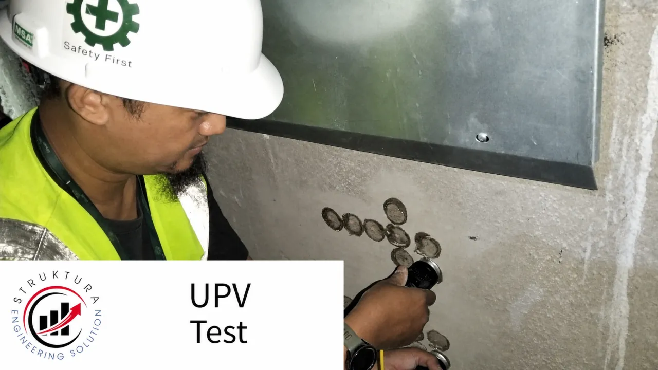 Technician placing a UPV transducer on a marked concrete test point