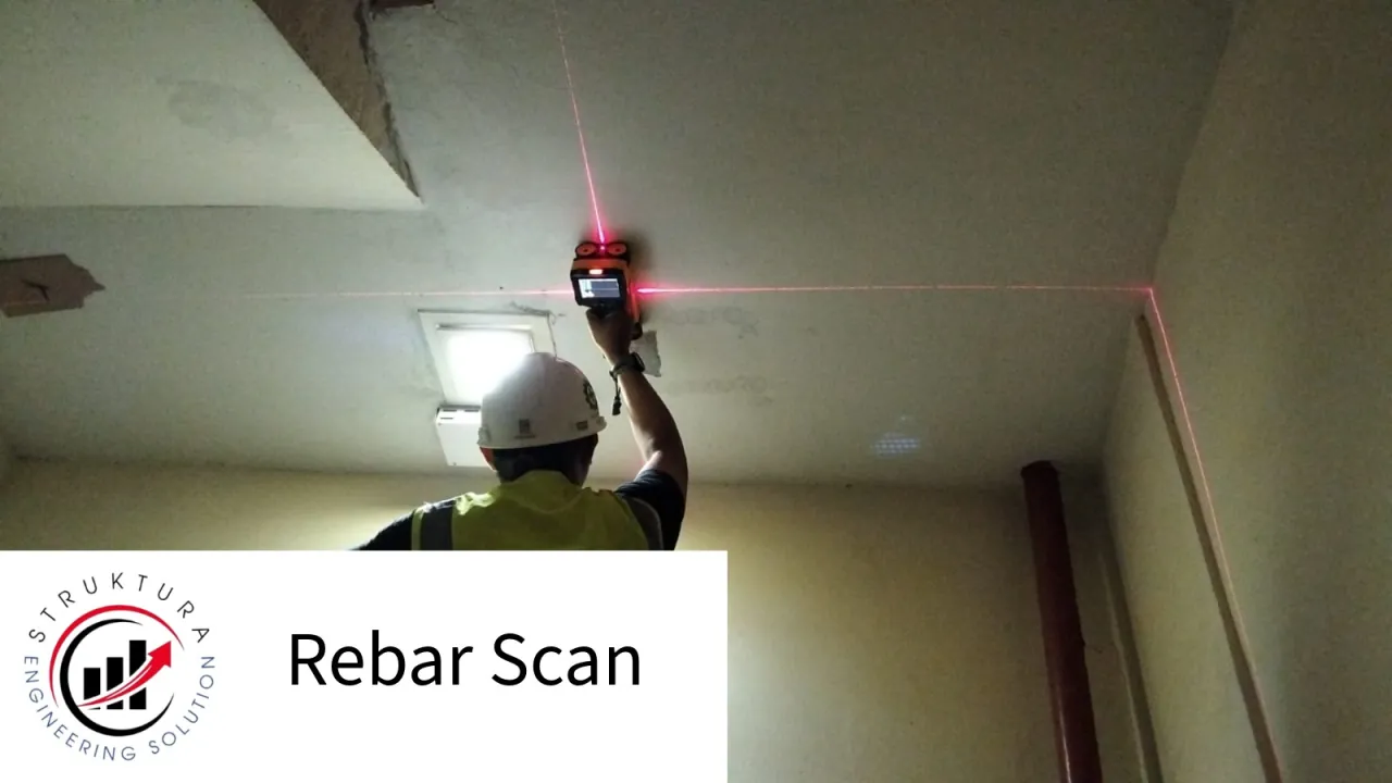 Technician scanning the underside of a concrete slab for reinforcement