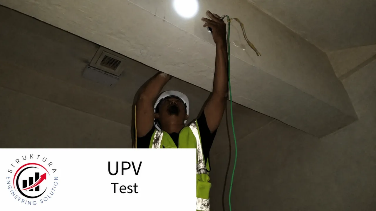 Technicians performing UPV measurements on an elevated concrete element