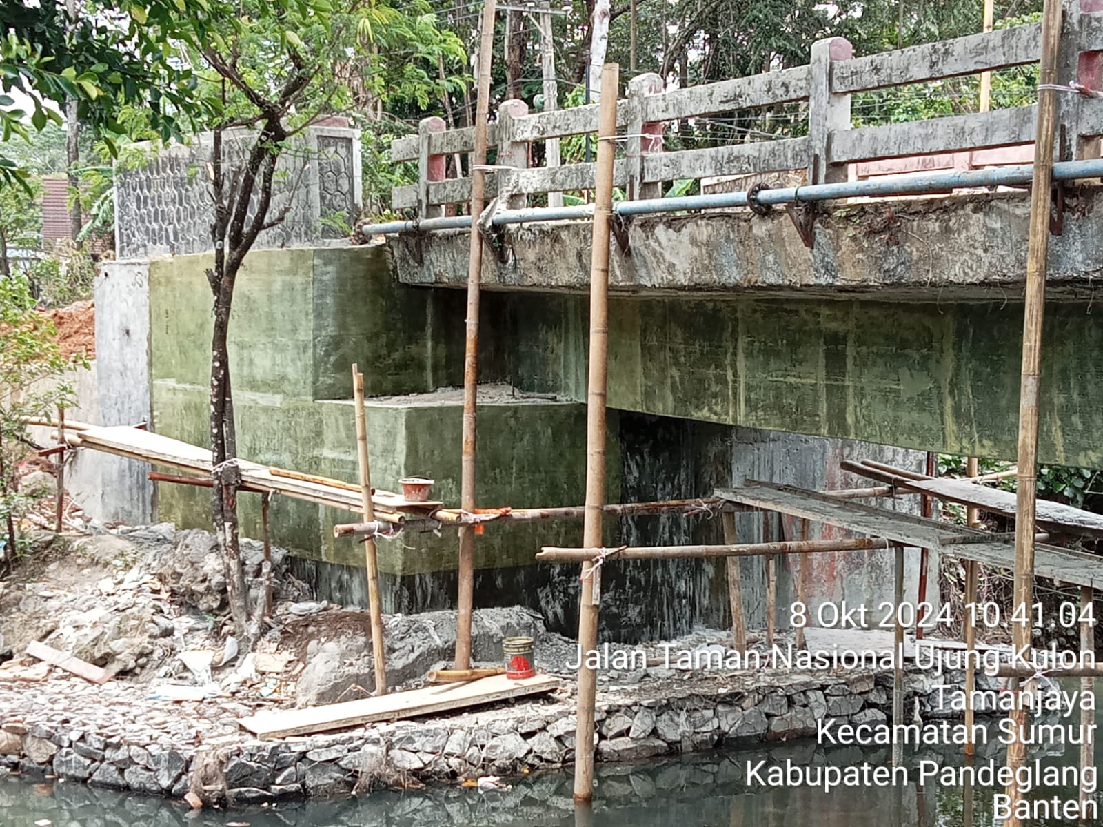 FRP-covered concrete surfaces beneath a bridge with access scaffolding in place